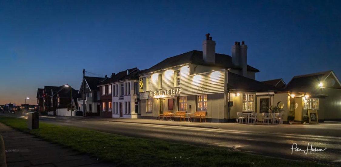 The Olive leaf Public House lit up at dark by Peter Jackson